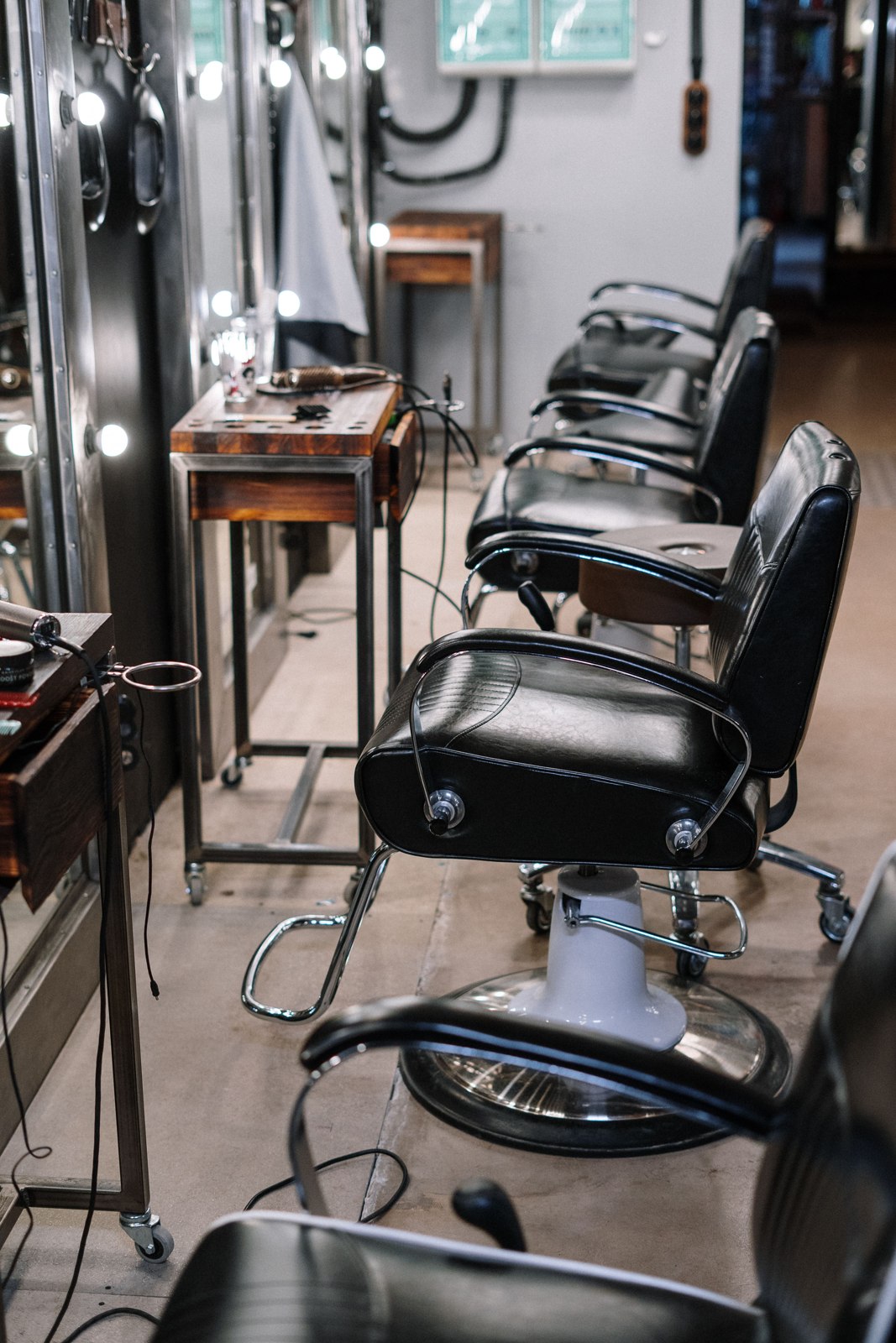 A warm barbershop with leather barber chairs
